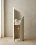 Load image into Gallery viewer, ARCHE in Cream in a plaster-walled room, a white long-haired cat resting on the upper perch, with the lower alcove and hanging pom-pom toy below
