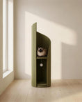 Load image into Gallery viewer, ARCHE in Green against a plain wall beside a window, with a seal-point cat resting in the upper alcove
