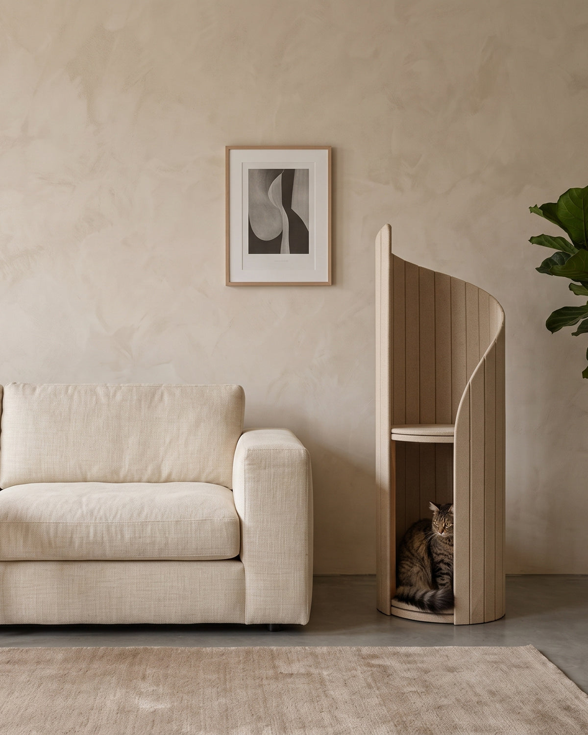 ARCHE in Cream beside a low linen sofa, showing its height against the furniture, with a white cat curled in the lower alcove