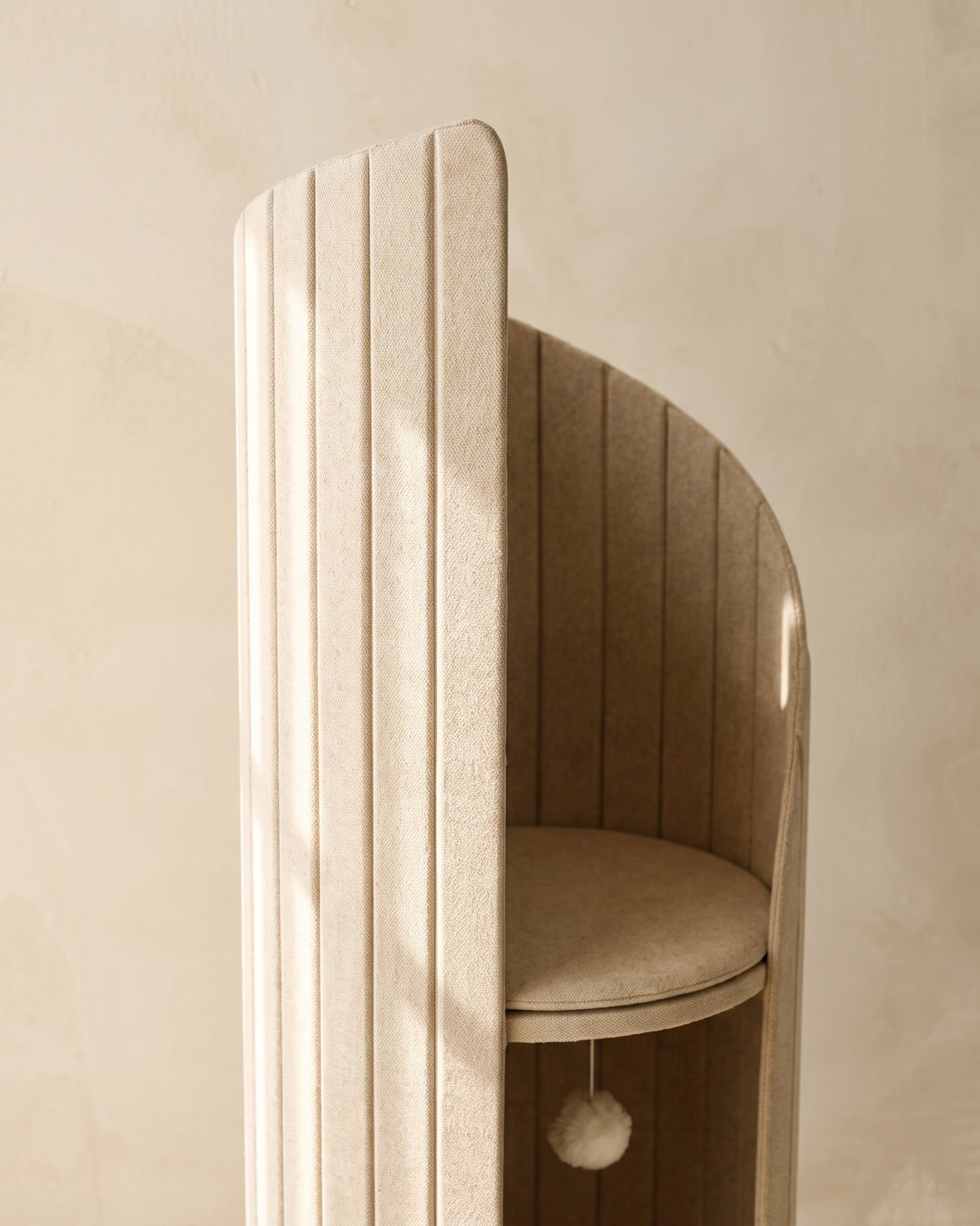 Close view of the upper section of ARCHE in Cream, showing the fluted surface and the curve of the outer wall
