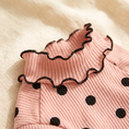 Load image into Gallery viewer, Close view of the Megève Dot Knit ruffled collar and ribbed knit
