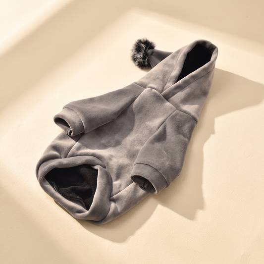 Gstaad Velour Hoodie in gray laid flat on a cream background
