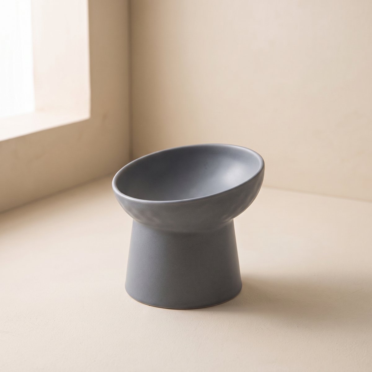 Pendio Raised Bowl in Gray on a cream ground