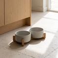 Load image into Gallery viewer, Coppia Bowl Set on a kitchen floor beside an oak cabinet in morning light
