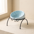 Load image into Gallery viewer, Onda Raised Bowl in Light Blue on a cream ground
