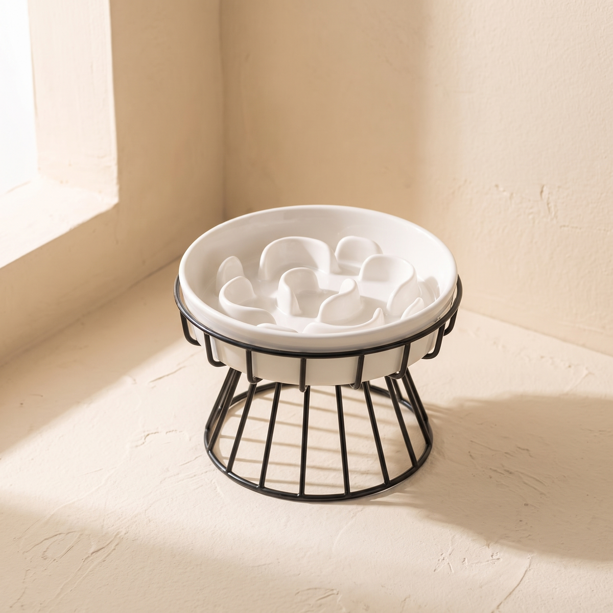 Lumière Slow Feeder Bowl, white ceramic bowl in a black metal stand
