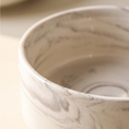 Load image into Gallery viewer, Close view of the Carrara bowl rim and the gray marbling in the porcelain
