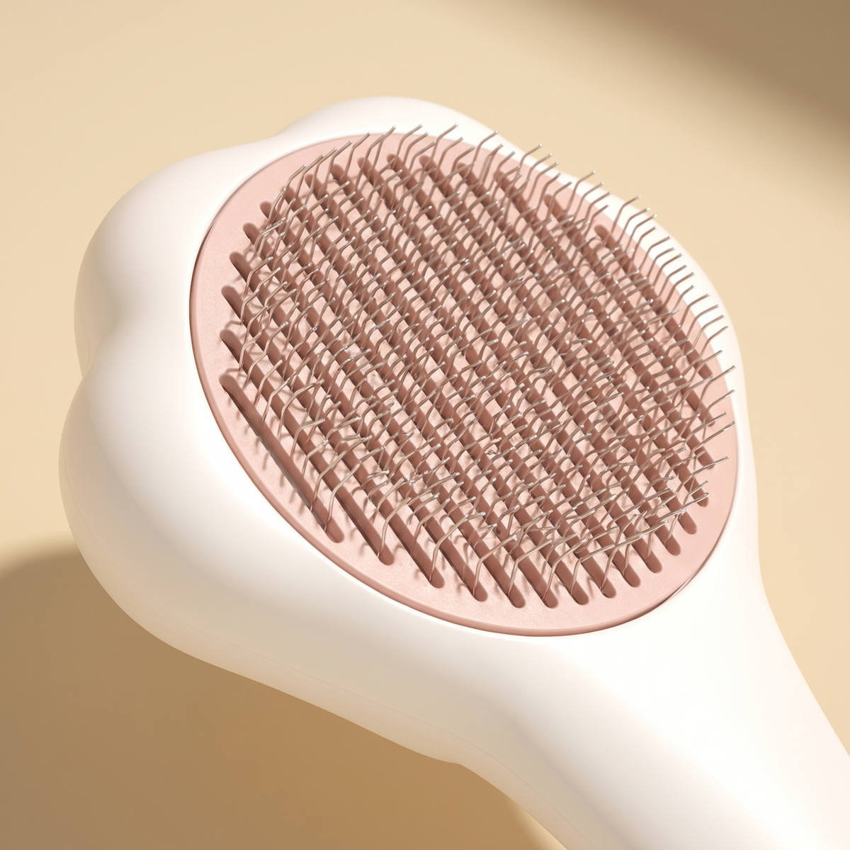 Close view of the FurEase brush head showing the bent wire pins