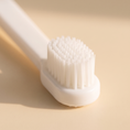 Load image into Gallery viewer, Close view of the GentleCare brush head and its soft silicone bristles
