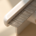 Load image into Gallery viewer, Close view of the Cinque comb teeth, fine metal with rounded ends

