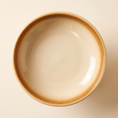 Load image into Gallery viewer, Cima Elevated Bowl from overhead, showing the amber reactive glaze ring around the basin

