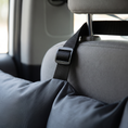 Load image into Gallery viewer, Close view of a Strada strap buckled around a car headrest post
