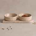Load image into Gallery viewer, Travertine pet bowl set: two natural travertine bowls seated in a single stone base plate
